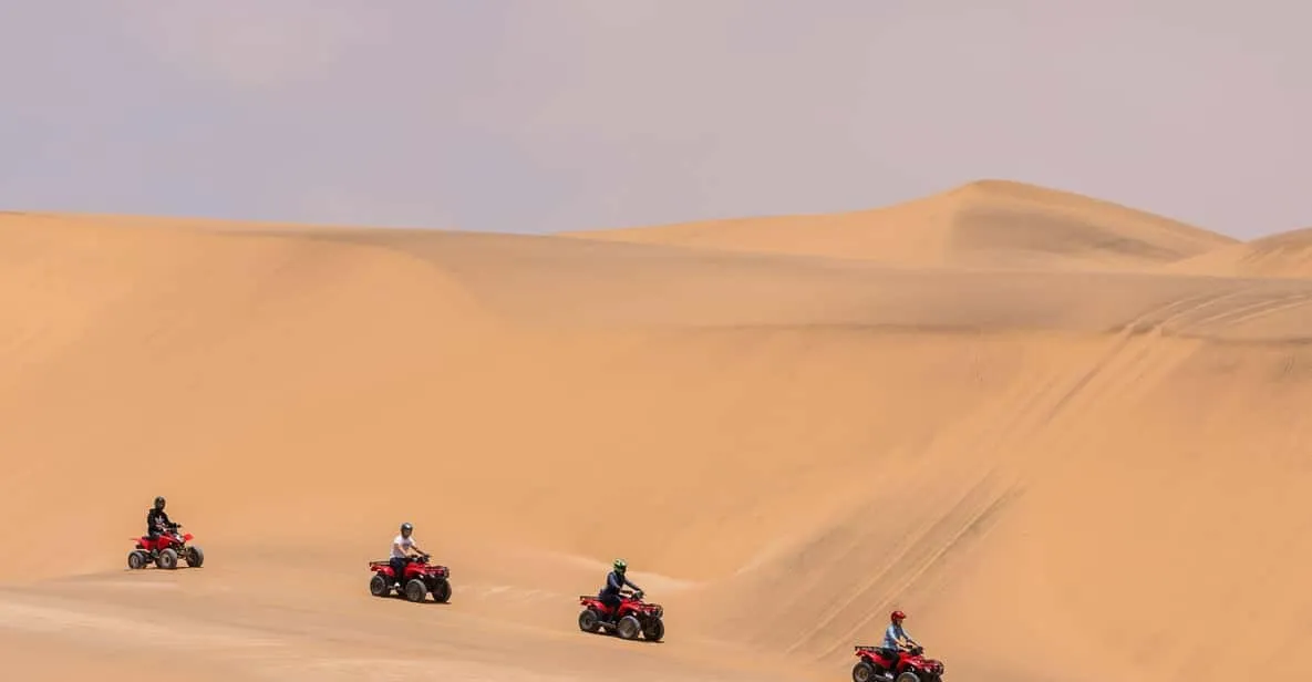 Quad bikes crossing the dune belt behind Swakopmund on a Namib Desert tour, Namibia