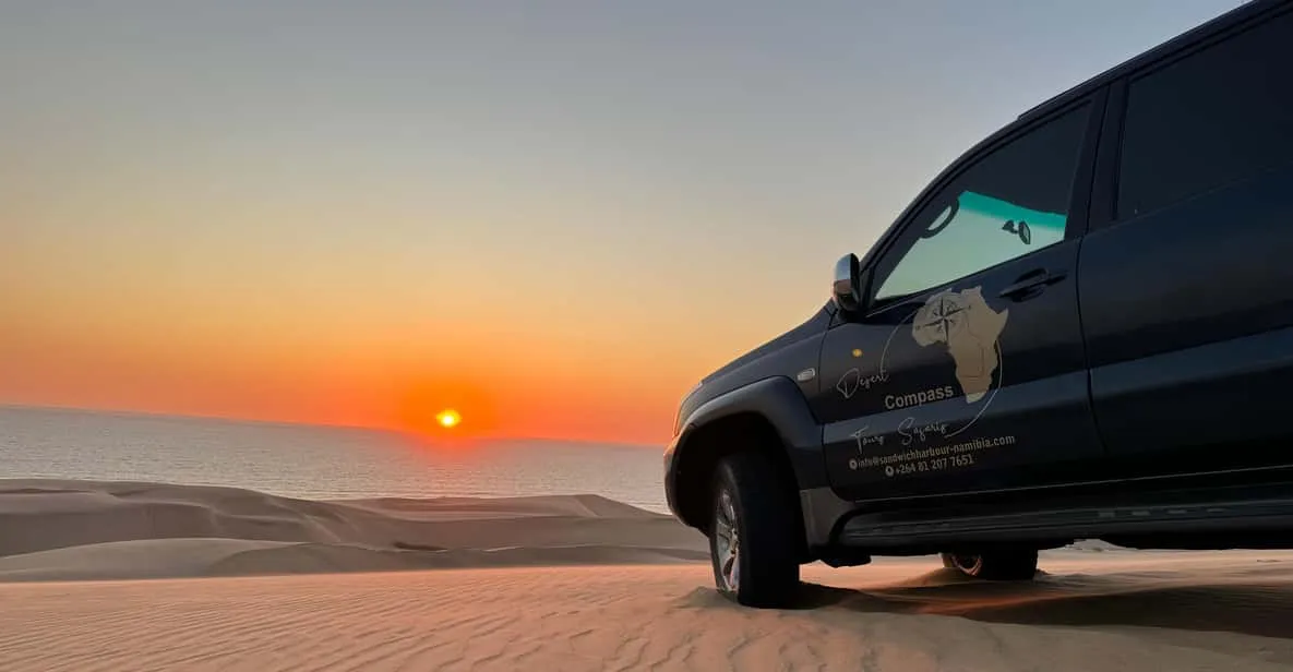Sunset over the dune belt on a Sandwich Harbour sunset dune drive in the Namib Desert, Namibia
